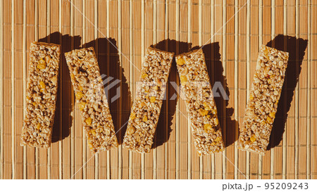 Homemade Granola energy bar. Variety of homemade protein granola breakfast bars, with nuts, raisins dried cherries and chocolate. Healthy nutrition eating Gluten free cereal dieting snack super food Homemade Granola energy bar. Variety of homemade protein granola breakfast bars, with nuts, raisins dried cherries and chocolate. Healthy nutrition eating Gluten free cereal dieting snack super food 95209243