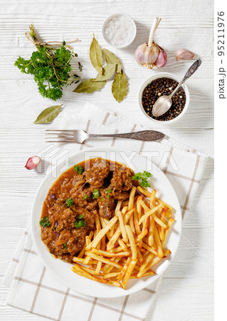 Flemish Stew, carbonnade, beef stew with fries Flemish Stew, carbonnade, beef stew with fries 95211976