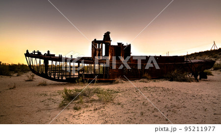 Panorama of ship cemetery at sunset near Moynaq, Karakalpakstan, Uzbekistan 95211977
