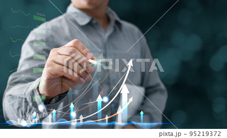 Businessmen draw growth graphs and progress of business and analyze financial, and investment.Use technology to plan strategy to success goals and growth.online business, e-commerce, online marketing. 95219372