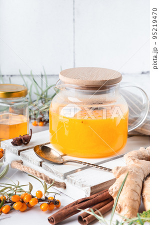 Homemade sea buckthorn tea with honey, ginger and spices Homemade sea buckthorn tea with honey, ginger and spices 95219470