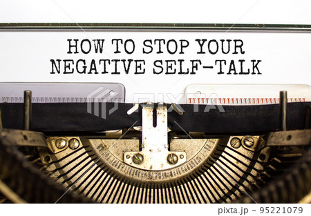 Stop negative self-talk symbol. Concept words How to stop your negative self-talk typed on old retro typewriter. Beautiful white background. Psychological stop negative self-talk concept. Copy space. 95221079