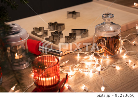 Christmas festively decorated kitchen with christmas lights, and cookie cutters 95223650