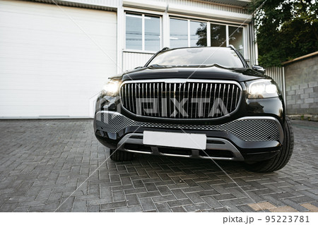 Black new suv luxury car parked at the street Black new suv luxury car parked at the street 95223781