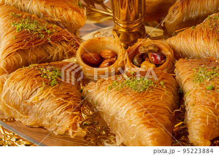 Variety of Turkish desserts served on cake stand 95223884