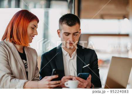 Businessman and businesswoman use modern devices, laptop, tablet and smartphone and arrange new projects for the job. Businessman and businesswoman use modern devices, laptop, tablet and smartphone and arrange new projects for the job. 95224083