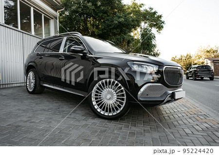 Black new suv luxury car parked at the street 95224420