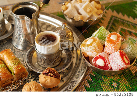 Turkish Coffee served with Turkish Delight on metal tray 95225109