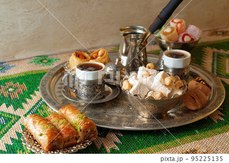 Turkish Coffee served with Turkish Delight on metal tray Turkish Coffee served with Turkish Delight on metal tray 95225135