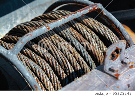 Old rusty steel cable steel wire on spool Old rusty steel cable steel wire on spool 95225245
