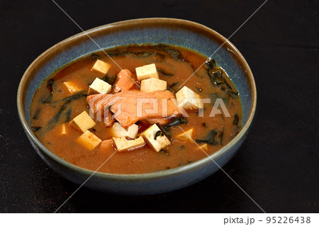Japanese miso soup in a gray bowl on the black table. horizontal view from above 95226438