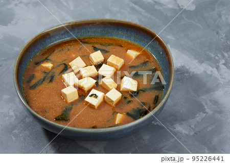 Japanese miso soup in a gray bowl on the black table. horizontal view from above 95226441