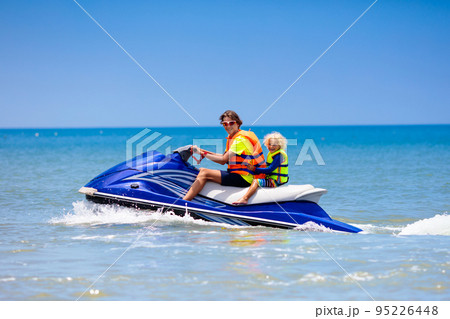 Family on jet ski. Water sports for kids. Family on jet ski. Water sports for kids. 95226448