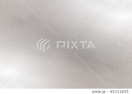 Glowing silver foil metal sheet wall with copy space, abstract metallic texture background 95231835