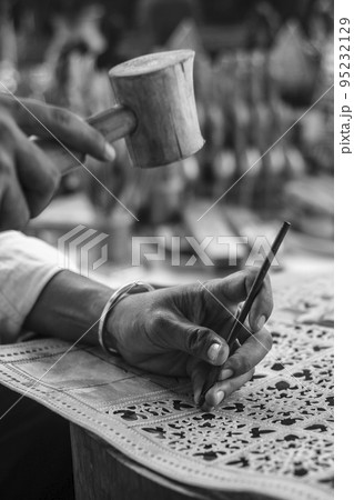 craft artist making traditional buffalo leather carving art in indonesia craft artist making traditional buffalo leather carving art in indonesia 95232129