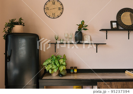 Wooden kitchen with beautiful decor and kitchenware 95237394