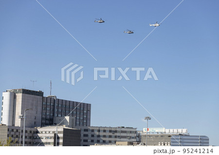 Helicopter. Airplane. Military vehicle. Spanish Air Force on the day of the National Holiday of October 12 flying over the streets of the city of Madrid. MADRID, SPAIN - OCTOBER 12, 2022. 95241214