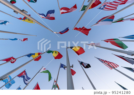 Doha, Qatar - October 9, 2022: The Flag Plaza, displays 119 flags from countries with authorized diplomatic missions, including flags of the European Union, the United Nation and the GCC. 95241280