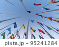 Doha, Qatar - October 9, 2022: The Flag Plaza, displays 119 flags from countries with authorized diplomatic missions, including flags of the European Union, the United Nation and the GCC. 95241284