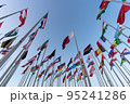 Doha, Qatar - October 9, 2022: The Flag Plaza, displays 119 flags from countries with authorized diplomatic missions, including flags of the European Union, the United Nation and the GCC. 95241286