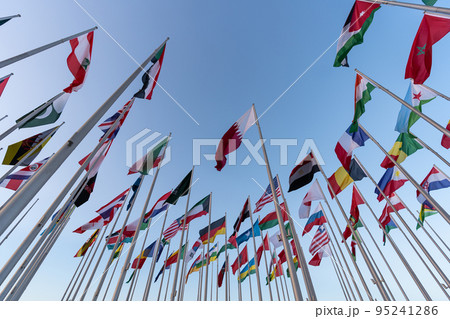 Doha, Qatar - October 9, 2022: The Flag Plaza, displays 119 flags from countries with authorized diplomatic missions, including flags of the European Union, the United Nation and the GCC. Doha, Qatar - October 9, 2022: The Flag Plaza, displays 119 flags from countries with authorized diplomatic missions, including flags of the European Union, the United Nation and the GCC. 95241286