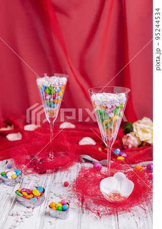 colorful sweets in champagne glasses colorful sweets in champagne glasses 95244534
