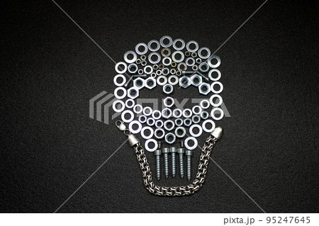 Metal art. Skull made by screw nuts, washers and bolts 95247645