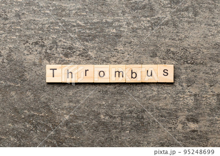 thrombus word written on wood block. thrombus text on table, concept 95248699