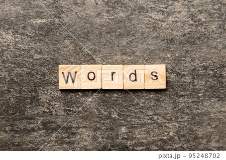 word written on wood block. WORD text on cement table for your desing, concept 95248702