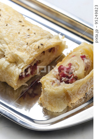 crispy pastry filled with smoked meat and sour cabbage crispy pastry filled with smoked meat and sour cabbage 95249823