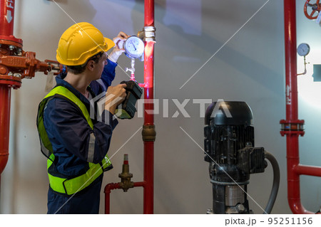 Engineer or technician work checking Fire suppression system and fire equipment. 95251156