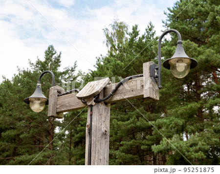 Plafond with lighting lamps in the village against the background of the forest. Copy space for text, traditional Plafond with lighting lamps in the village against the background of the forest. Copy space for text, traditional 95251875