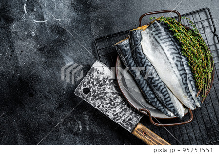 Raw Fresh fillet mackerel fish. Black background. Top view. Copy space 95253551