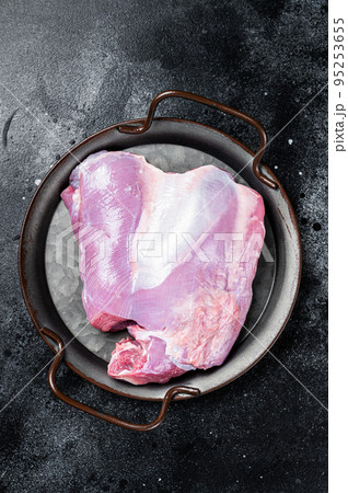 Raw Turkey boneless and skinless thigh fillet. Farm eco meat. Black background. Top view Raw Turkey boneless and skinless thigh fillet. Farm eco meat. Black background. Top view 95253655