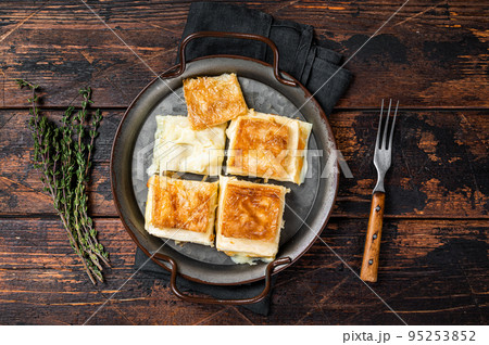 Turkish Su Boregi, Tabla borek or Adana Borek with cheese. Wooden background. Top view 95253852