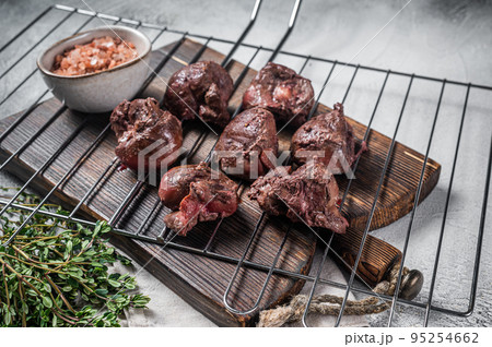 BBQ Grilled lamb mutton kidney, offal meat on grill. White background. Top view 95254662