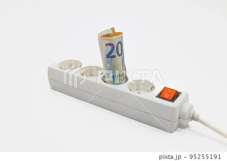 Euro banknotes plugged into the power strip. Concept of expensive electricity prices Euro banknotes plugged into the power strip. Concept of expensive electricity prices 95255191