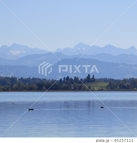 Lake Pfaeffikon and mountain ranges seen from Pfaeffikon, Switzerland. 95257111