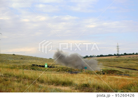War Concept. Military silhouettes fighting scene on war fog sky background, World War Soldiers Silhouette Below Cloudy Skyline At night. Armored vehicle fight scene. Selective focus 95260426