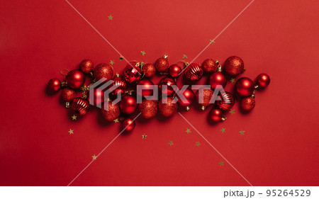 Beautiful red decoration balls Christmas toys red background. Festive mockup Christmas or New Year 95264529