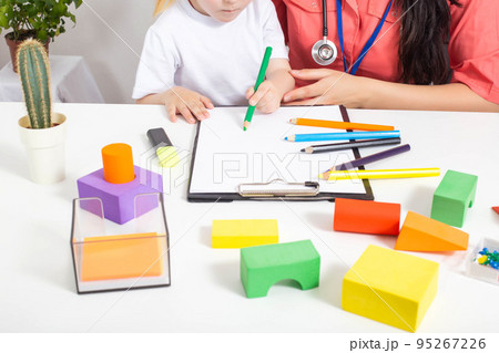 Little caucasian girl 3-4 years old at the appointment with a pediatrician. Varieties of children's doctors, children's medicine 95267226