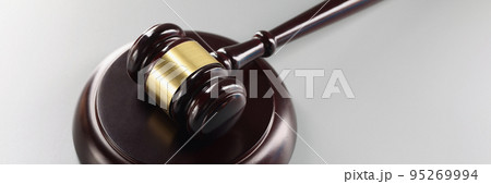 Red judge's gavel on a gray background 95269994