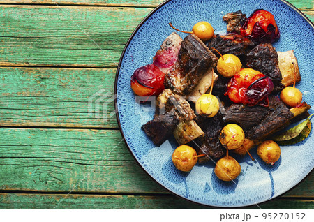 Meat on ribs with fruits,copy space Meat on ribs with fruits,copy space 95270152