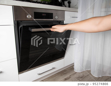 Black modern electric oven in white kitchen with thermo grill and convection function. 3d hot air and vario-grill, large 95274866