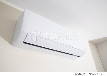 Wall mounted air conditioner in a modern apartment. The concept of maintaining a comfortable room temperature. Close-up 95274970