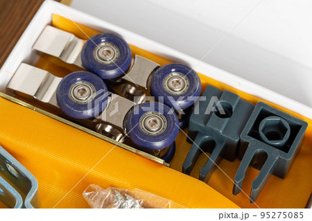 set of roller mechanism for sliding doors. Door furniture, close-up set of roller mechanism for sliding doors. Door furniture, close-up 95275085