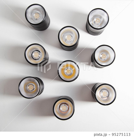 Overhead black LED lamps for a stretch ceiling on a white background. Close-up 95275113