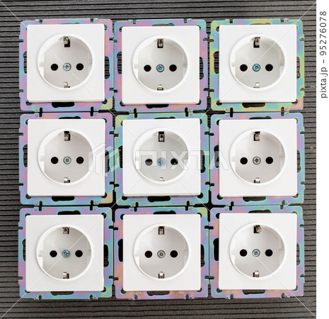 Background from home electric sockets, close-up. The concept of tariffs and prices for electricity Background from home electric sockets, close-up. The concept of tariffs and prices for electricity 95276078