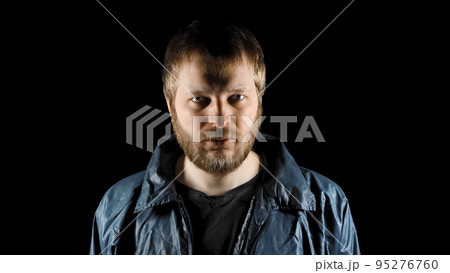 Closeup portrait of bearded homeless on dark background. Tramp in dirty clothes. Below poverty line concept. Male refugee. Consequences of drunkenness, alcoholism. Fugitive beggar. Illegal immigrant 95276760