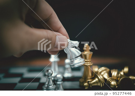 Strategy and business planning ideas. Chess horse silver on the board. Strategy and business planning ideas. Chess horse silver on the board. 95277446